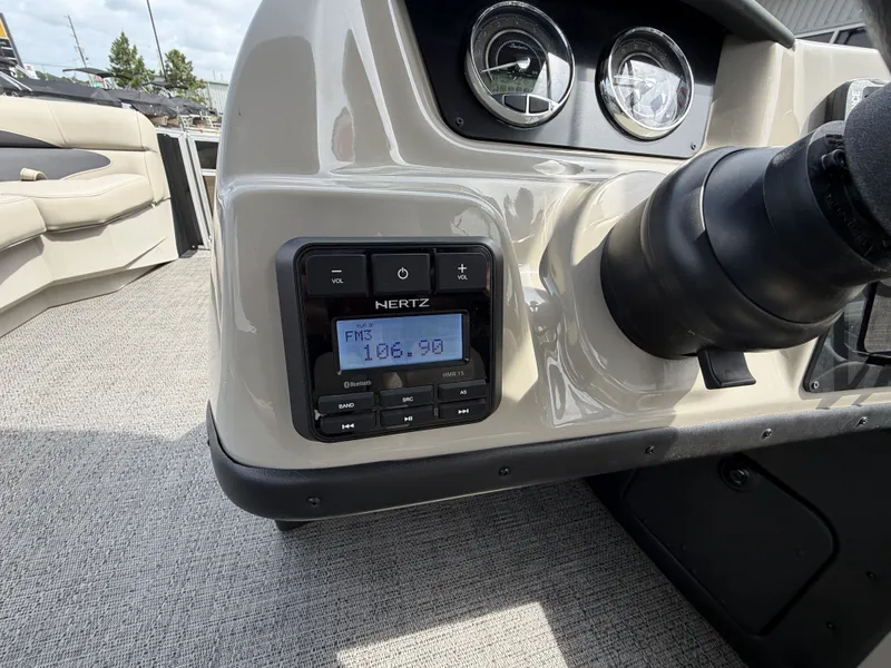 Slide: The Image of The image shows the dashboard of a 2024 Barletta A20UC boat with a radio. - 19