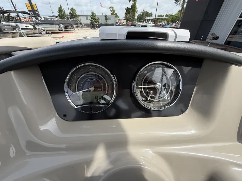 Slide: The Image of Dashboard of a Barletta A20UC boat with two round gauges. - 20