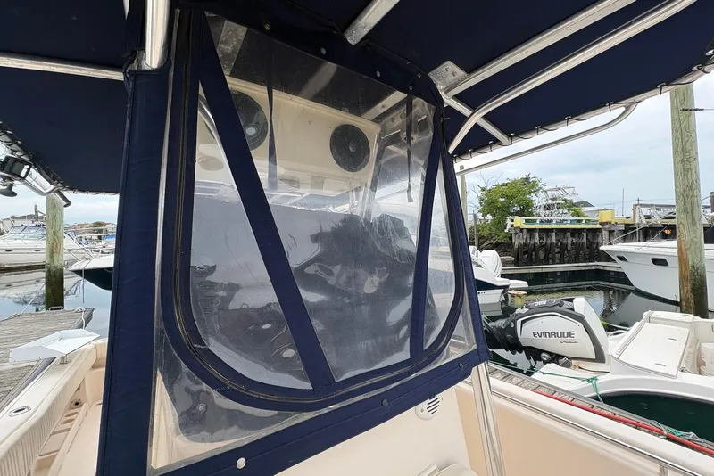 Slide: The Image of 2006 Grady-White Advance 257 boat with Evinrude engine at marina dock. - 6
