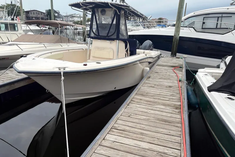 Slide: The Image of 2006 Grady-White Advance 257 boat docked at marina, side view. - 1