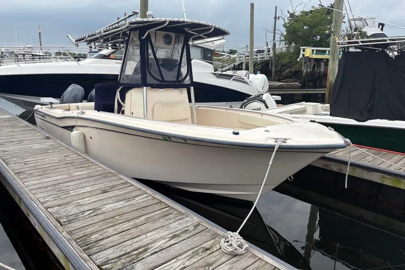 Slide: The Image of 2006 Grady-White Advance 257 boat docked at marina, side view. - 3
