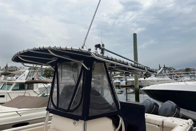 Slide: The Image of 2006 Grady-White Advance 257 boat with T-top, docked in marina. - 5