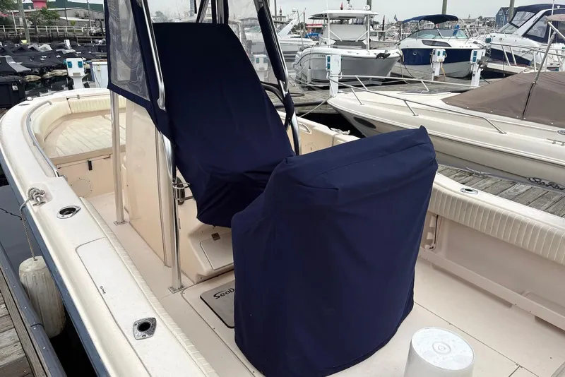 Slide: The Image of 2006 Grady-White Advance 257 boat with covered seats docked at marina. - 9