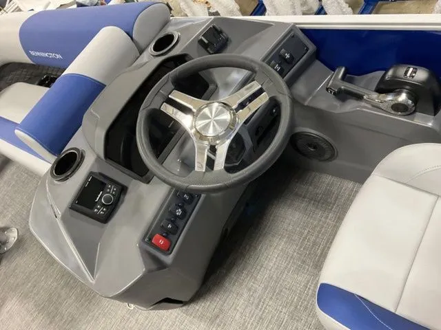 Slide: The Image of The image shows the helm of a 2025 Bennington S Swingback 22 SSB with a gray and blue design. - 10