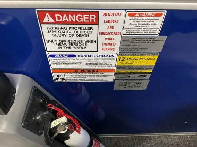 Slide: The Image of Warning labels on a boat, including propeller danger and maximum capacity of 12 persons. - 11