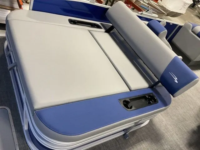 Slide: The Image of The image shows a luxurious gray and blue boat seat with cup holders. - 13