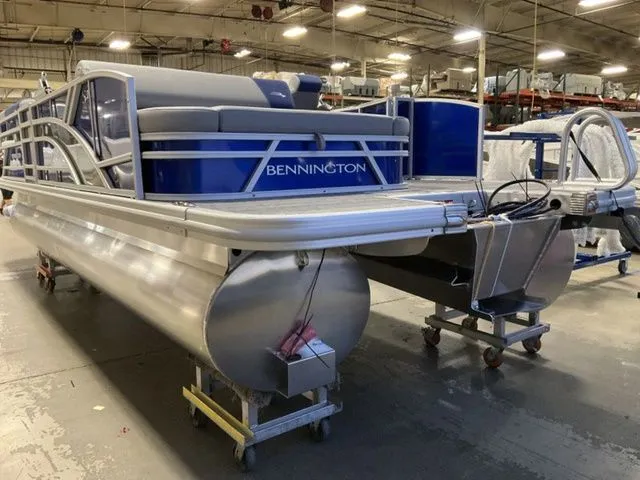 Slide: The Image of Bennington S Swingback 22 SSB 2025 in a warehouse setting. - 5