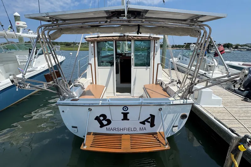 Slide: The Image of Cape Dory 30 Motorsailer, 1989 model, docked in Marshfield, MA, rear view. - 3