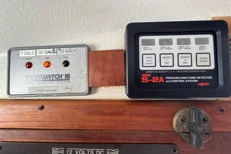 Slide: The Image of Control panels on a 1989 Cape Dory 30 Motorsailer, featuring water level and fume detection systems. - 36