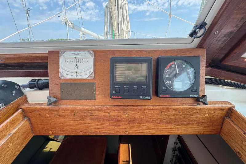 Slide: The Image of Control panel of a 1989 Cape Dory 30 Motorsailer with navigation instruments. - 12