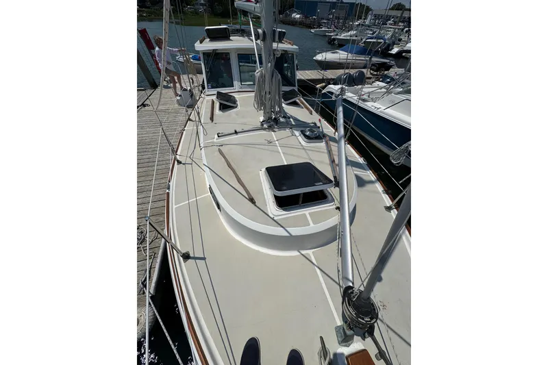 Slide: The Image of 1989 Cape Dory 30 Motorsailer docked, showcasing deck and rigging details. - 7