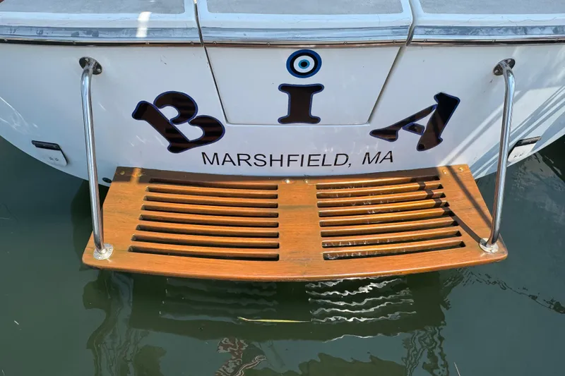 Slide: The Image of Stern of 1989 Cape Dory 30 Motorsailer with wooden swim platform, Marshfield, MA. - 4