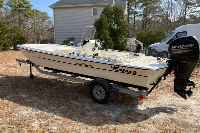 The Image of 2014 Mako Pro Skiff 17 CC boat on trailer with Mercury outboard motor. - 0