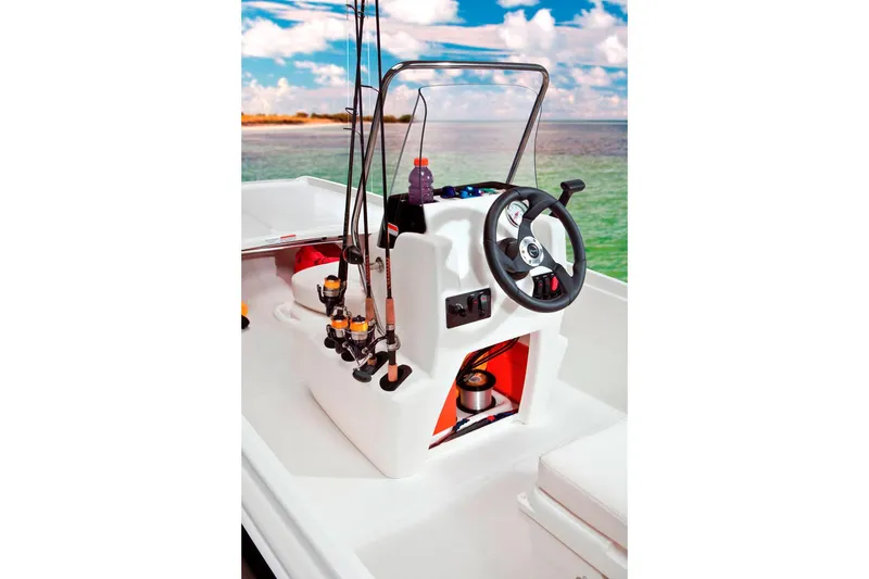 Slide: The Image of Manufacturer Provided Image: 2014 Mako Pro Skiff 17 CC boat console with fishing rods and steering wheel. - 8