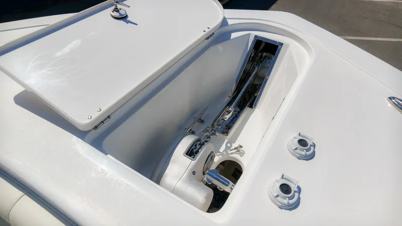 Slide: The Image of An open storage compartment on a boat with anchor and chain mechanism. - 33