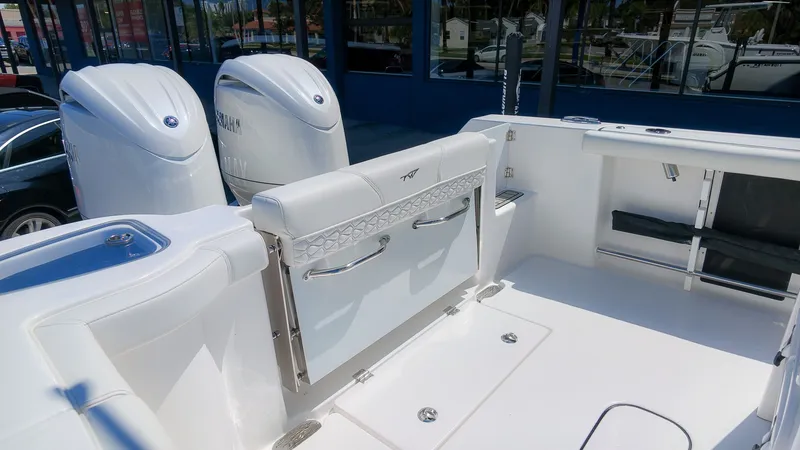 Slide: The Image of The image shows the cockpit of a Tidewater 272 CC Adventure boat with dual engines. - 11