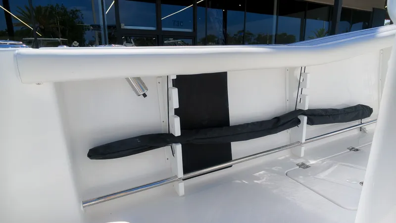 Slide: The Image of The image shows the interior of a boat with white upholstery and black details. - 14