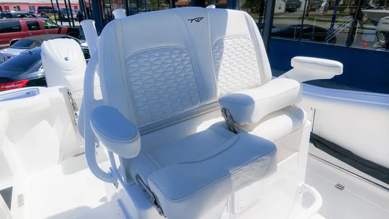 Slide: The Image of Luxurious white double seat with quilted pattern and armrests on a boat. - 25