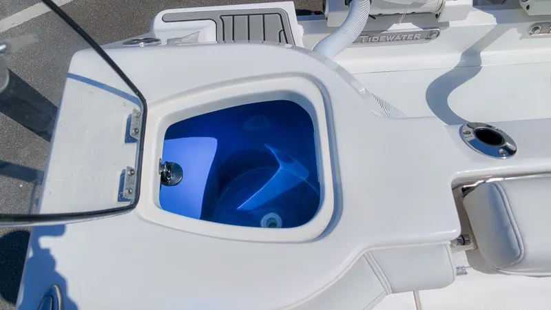 Slide: The Image of A modern boat featuring a lit blue livewell and stainless steel fittings. - 13