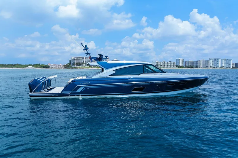The Image of 2026 Formula 500 Super Sport Crossover yacht cruising on blue ocean near city skyline. - 0