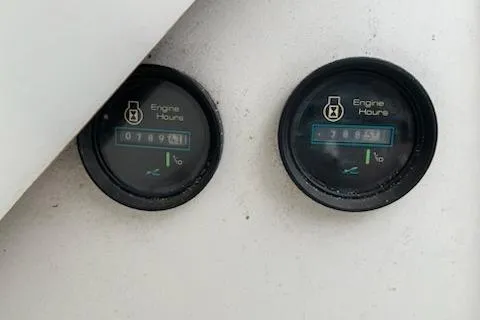 Slide: The Image of Close-up of engine hour meters on a 1989 Sea Ray 300 Sundancer boat. - 11
