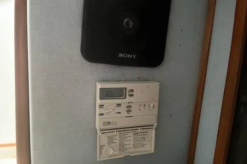 Slide: The Image of Sony speaker and control panel inside 1989 Sea Ray 300 Sundancer boat. - 13