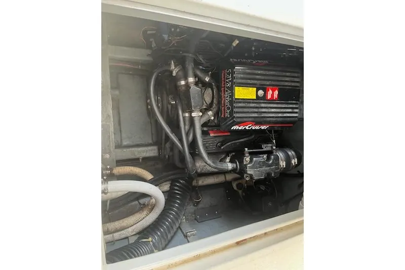 Slide: The Image of Engine compartment of a 1989 Sea Ray 300 Sundancer with MerCruiser components. - 5