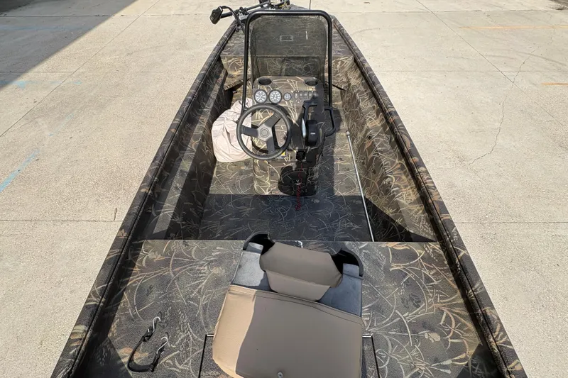 Slide: The Image of 2018 Excel 1854 Shallow Water F4 Console boat with camouflage interior design. - 11