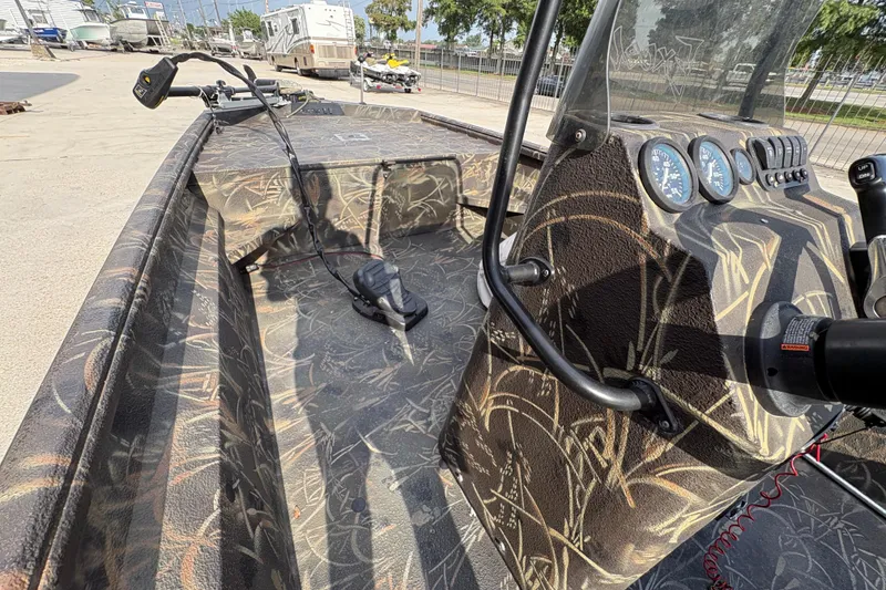 Slide: The Image of 2018 Excel 1854 Shallow Water F4 Console boat with camouflage interior design. - 13