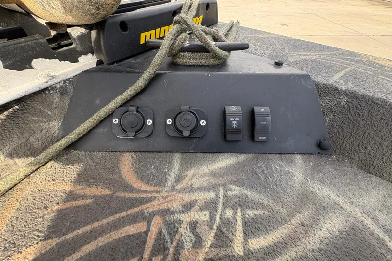Slide: The Image of Control panel of a 2018 Excel 1854 Shallow Water F4 Console boat with switches and outlets. - 18