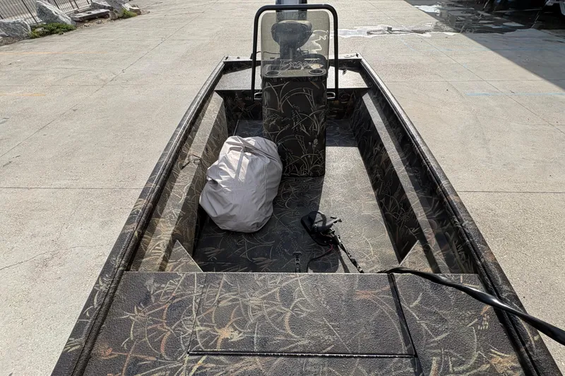 Slide: The Image of 2018 Excel 1854 Shallow Water F4 Console boat with camouflage interior design. - 19