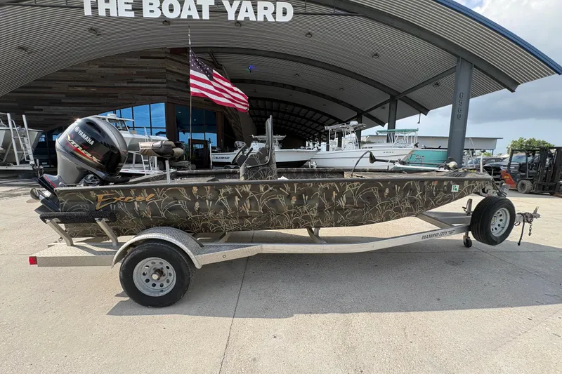 Slide: The Image of 2018 Excel 1854 Shallow Water F4 Console boat on trailer at The Boat Yard. - 2