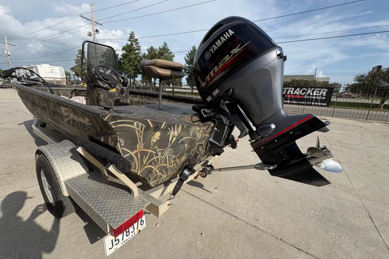 Slide: The Image of 2018 Excel 1854 Shallow Water F4 Console boat with Yamaha outboard motor on trailer. - 5
