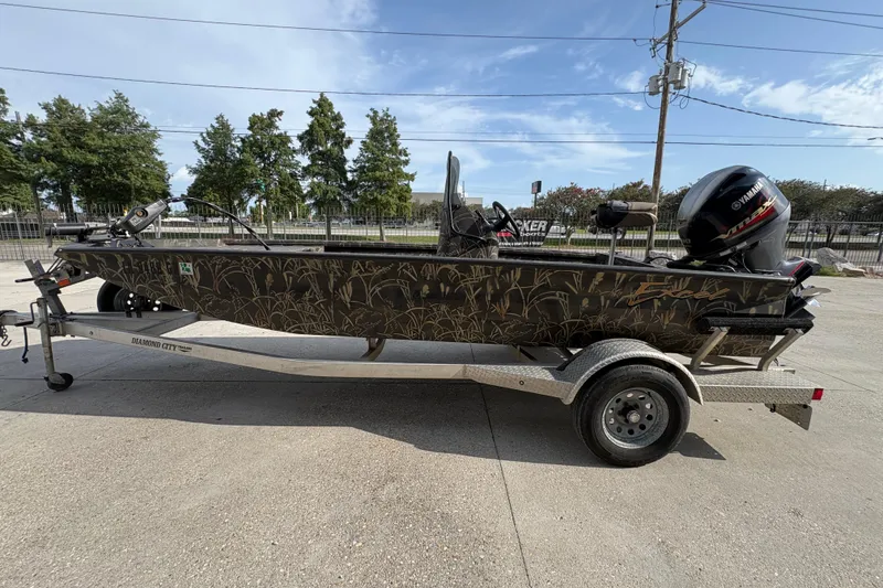 Slide: The Image of 2018 Excel 1854 Shallow Water F4 Console boat on trailer, camo design, Yamaha motor. - 6