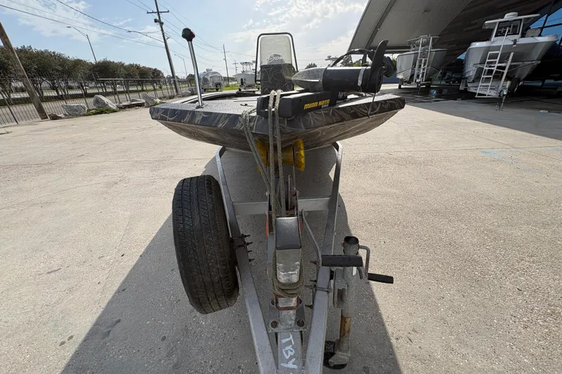 Slide: The Image of 2018 Excel 1854 Shallow Water F4 Console boat on trailer in outdoor setting. - 8