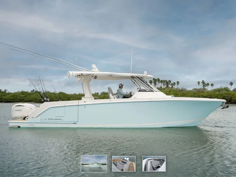 Slide: The Image of A Regal 34 SAV boat on calm water with fishing rods and a driver on board. - 2