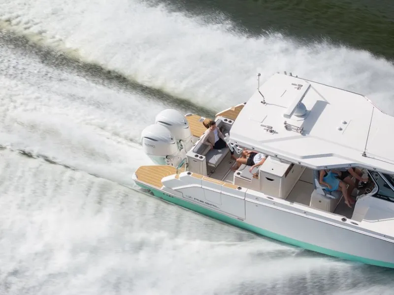Slide: The Image of A Regal 34 SAV boat speeding across the water. - 22