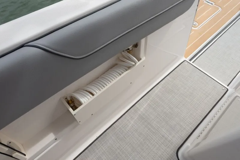Slide: The Image of A Regal 34 SAV boat with a built-in hose compartment on deck. - 26