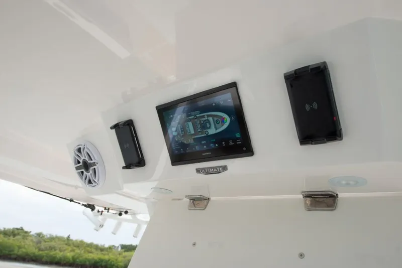 Slide: The Image of The image shows a boat's dashboard with a screen and speakers. - 28