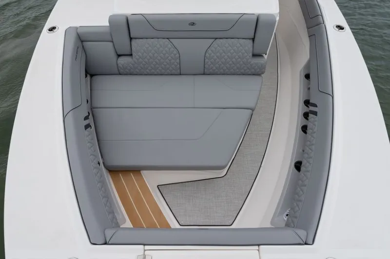 Slide: The Image of The image shows the bow area of a Regal 34 SAV boat with gray upholstery. - 46