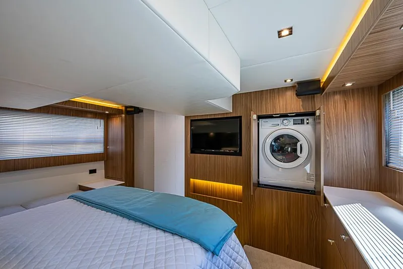 Slide: The Image of Luxurious 2025 Cruisers Yachts 50 Cantius bedroom with modern amenities and elegant wood finishes. - 22