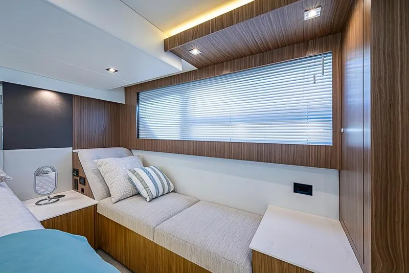 Slide: The Image of Luxurious interior of 2025 Cruisers Yachts 50 Cantius with modern seating and elegant wood paneling. - 23