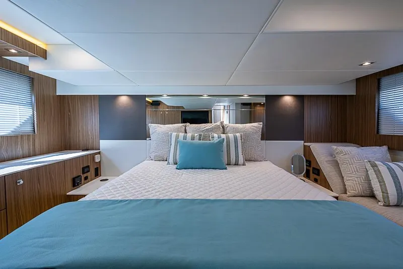 Slide: The Image of Luxurious bedroom interior of 2025 Cruisers Yachts 50 Cantius with modern design and cozy bedding. - 26