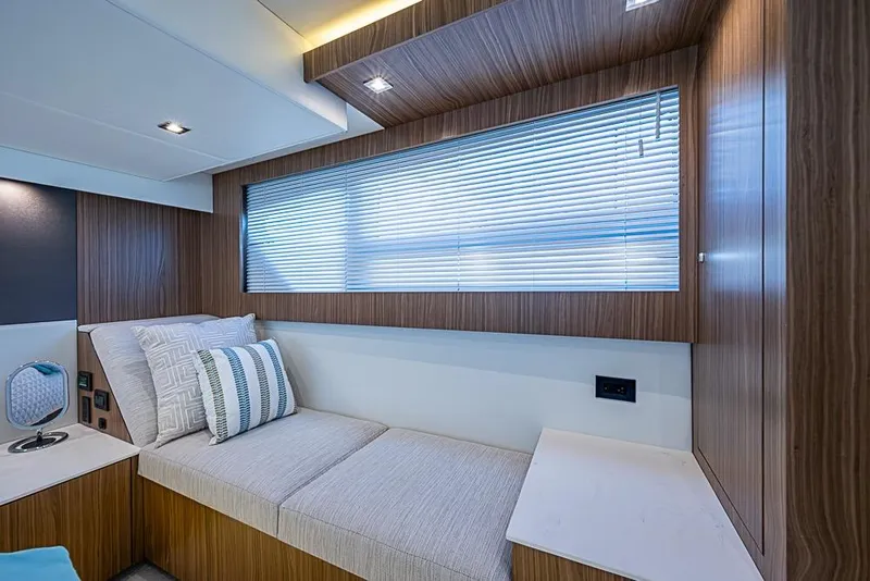 Slide: The Image of Luxurious interior cabin of 2025 Cruisers Yachts 50 Cantius with modern wood paneling. - 28