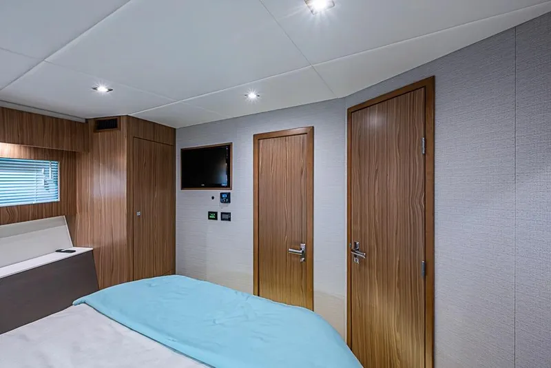 Slide: The Image of Luxurious interior of 2025 Cruisers Yachts 50 Cantius with modern wood finishes and ambient lighting. - 31