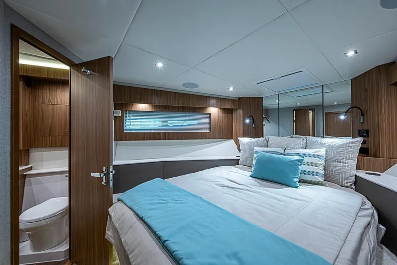 Slide: The Image of Luxurious bedroom interior of 2025 Cruisers Yachts 50 Cantius with modern design and cozy bedding. - 32