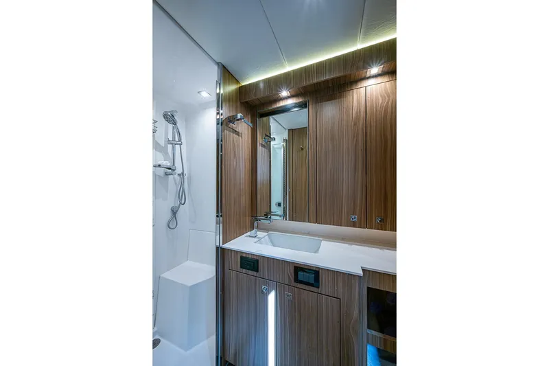 Slide: The Image of Luxurious bathroom interior of 2025 Cruisers Yachts 50 Cantius with modern fixtures and wood accents. - 37