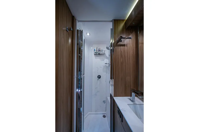 Slide: The Image of Luxurious bathroom interior of 2025 Cruisers Yachts 50 Cantius, featuring modern fixtures and wood accents. - 38