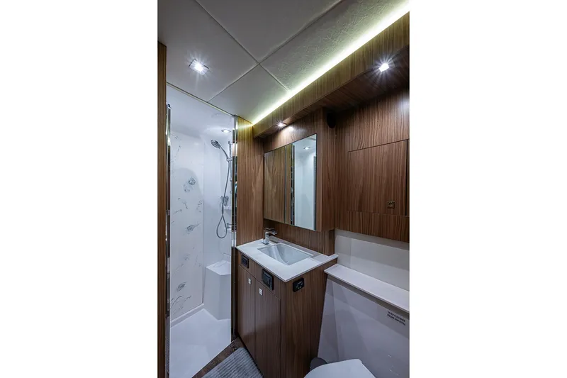 Slide: The Image of Luxurious bathroom in 2025 Cruisers Yachts 50 Cantius, featuring modern wood finishes and elegant lighting. - 41