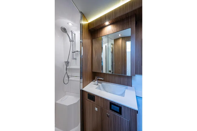 Slide: The Image of Luxurious bathroom in 2025 Cruisers Yachts 50 Cantius, featuring modern fixtures and elegant wood finishes. - 42